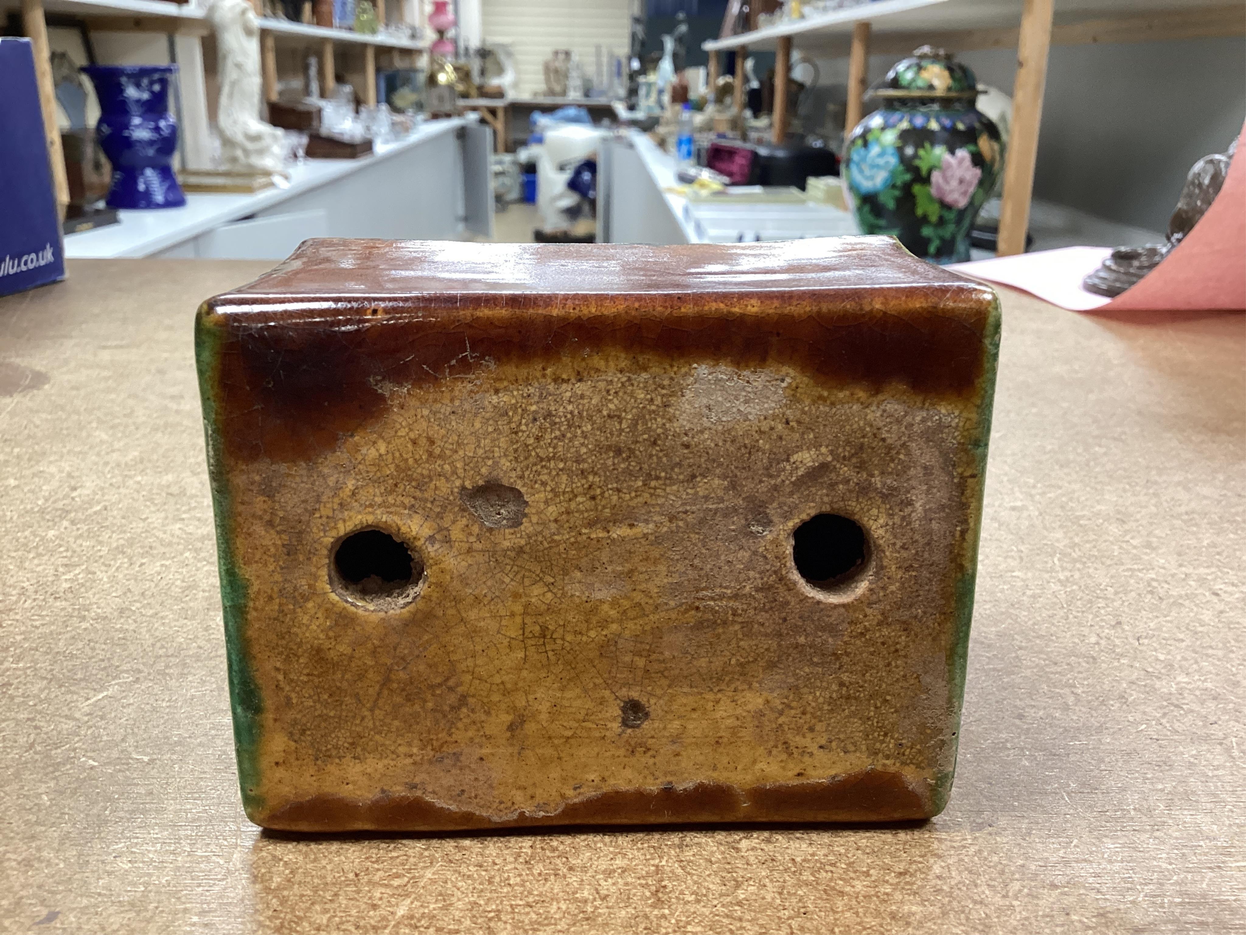 A Chinese stone ware arm rest, 10cm wide